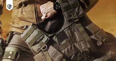 Man in tactical gear carrying a plate carrier