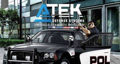 ATEK logo with police officer holding a weapon behind a squad car